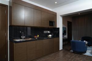 Virtuve vai virtuves zona naktsmītnē C - Hotel and Suites Doha