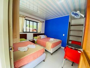 Postel nebo postele na pokoji v ubytování Hotel Caribe La Vega