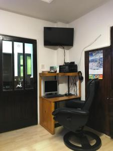 a room with a desk with a computer and a chair at Salaš Striber in Vrbas