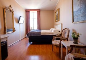 Voodi või voodid majutusasutuse Eksjö Stadshotell toas