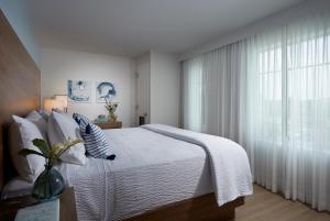 Voodi või voodid majutusasutuse The Pointe Hotel toas