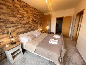 A bed or beds in a room at TATRANSKY DOM sk