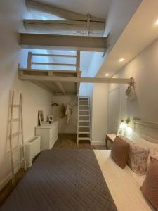a bedroom with a bed and a loft at Corte Santa Caterina in Florence in Florence