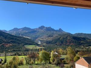 a view of the mountains from the house at studio moderne in Barcelonnette