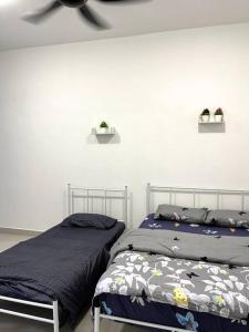 Кровать или кровати в номере Azzalea Homes 6 @ Taman Golden Hills Cameron Highlands