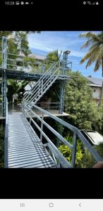 a metal staircase leading up to a bridge at Rain Homestay in Alleppey