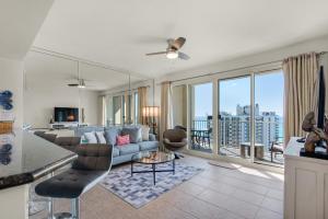 a living room with a couch and a large window at Ariel Dunes I 1705 in Destin