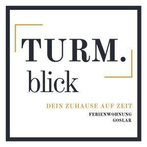 a poster with the text trump black and gold at TURM.blick in Goslar