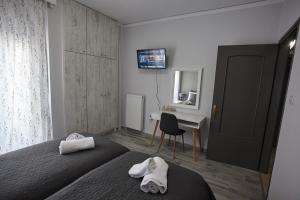 Posteľ alebo postele v izbe v ubytovaní C.L.A. 2 City Lux Apartment Alaxandroupoli