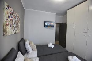 Posteľ alebo postele v izbe v ubytovaní C.L.A. 2 City Lux Apartment Alaxandroupoli