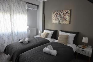 Posteľ alebo postele v izbe v ubytovaní C.L.A. 2 City Lux Apartment Alaxandroupoli