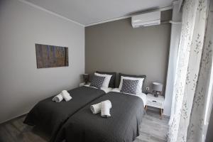 Posteľ alebo postele v izbe v ubytovaní C.L.A. 2 City Lux Apartment Alaxandroupoli