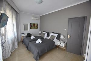 Posteľ alebo postele v izbe v ubytovaní C.L.A. 2 City Lux Apartment Alaxandroupoli