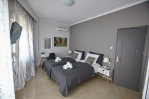 Posteľ alebo postele v izbe v ubytovaní C.L.A. 2 City Lux Apartment Alaxandroupoli