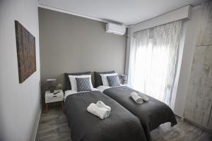 Posteľ alebo postele v izbe v ubytovaní C.L.A. 2 City Lux Apartment Alaxandroupoli