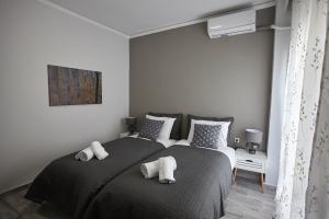 Posteľ alebo postele v izbe v ubytovaní C.L.A. 2 City Lux Apartment Alaxandroupoli