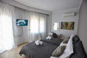 Posteľ alebo postele v izbe v ubytovaní C.L.A. 2 City Lux Apartment Alaxandroupoli