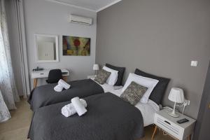Posteľ alebo postele v izbe v ubytovaní C.L.A. 2 City Lux Apartment Alaxandroupoli