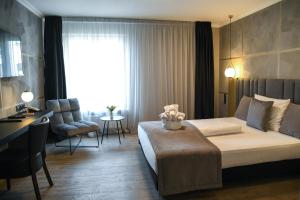 Postel nebo postele na pokoji v ubytování Hotel Zum Weissen Ross