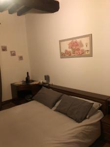 a bedroom with a bed and a desk in it at La Tenuta di Leo in San Giovanni in Persiceto