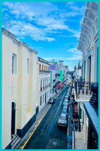 a view of a city street with cars parked at 310Guest-House La Vida in San Juan