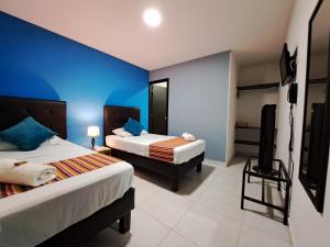 Postel nebo postele na pokoji v ubytování Hotel 9-25