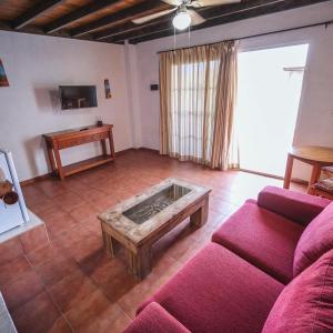 a living room with a couch and a coffee table at Club JM Lanzarote in Tabayesco