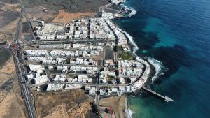 an aerial view of a village on the ocean at Club JM Lanzarote in Tabayesco