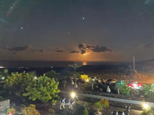 a view of a parking lot at night at Club JM Lanzarote in Tabayesco