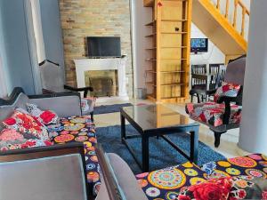 a living room with a couch and a fireplace at Ali Luxury Villa in Luxor