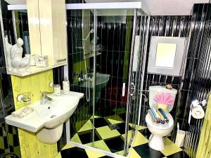 a bathroom with a sink and a toilet and a shower at Apartmani Tamara in Tivat +23 photos