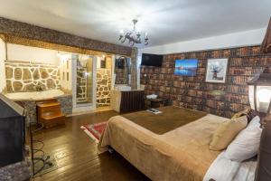 a hotel room with a bed and a bathroom at Cities of the World - Apartments Cusco in Cusco