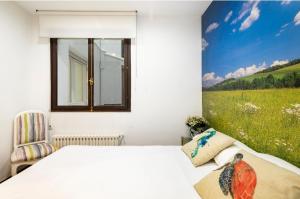 Łóżko lub łóżka w pokoju w obiekcie Lujoso y amplio piso con 5 habitaciones
