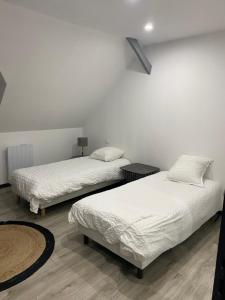 Posteľ alebo postele v izbe v ubytovaní Gîte de l’Europe