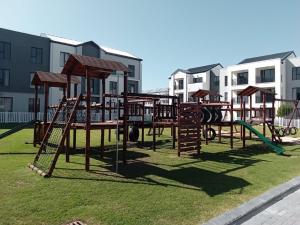 a park with a playground with a slide at Cederberg Estate in Cape Town