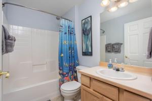 a bathroom with a sink and a toilet and a shower at Alpine Escape in Leavenworth