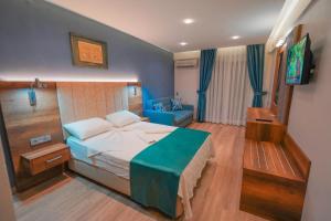 Postel nebo postele na pokoji v ubytování Hotel Amore