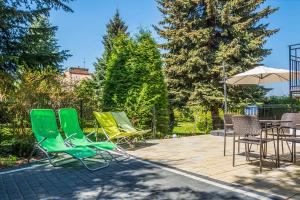 Vonkajšia záhrada v ubytovaní Apartamenty nad jeziorem charzykowskim Villa Emilia
