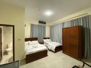 Postel nebo postele na pokoji v ubytování Sneferu Hotel