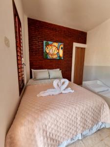 Aloha Beach Guest House客房内的一张或多张床位