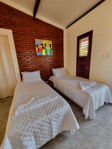 Aloha Beach Guest House客房内的一张或多张床位