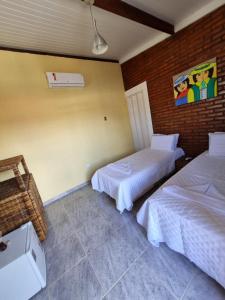 Aloha Beach Guest House客房内的一张或多张床位