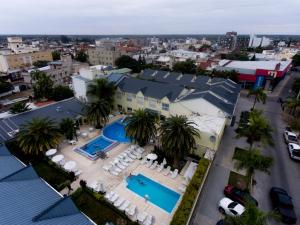 an aerial view of a resort with two swimming pools at Hotel Alto Verde in Termas de Río Hondo
