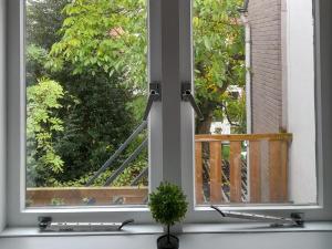 a window with a view of a deck at Annalisa Guest House Centrum in Enschede