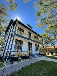 a blue and white house with a porch at 1001 Nights Historic Bed and Breakfast Adults Only in St. Augustine