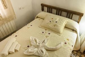 Postel nebo postele na pokoji v ubytování Apartamentos Rurales La Casa de Luis