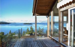 a house with a view of the water at Awesome Home In Jrpeland With 4 Bedrooms in Jørpeland