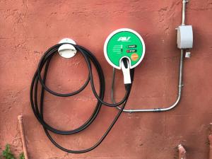 a green and white object is attached to a wall at Luxury 1920s Bank Loft, Art Gallery & Music Space in Tomales, CA in Tomales