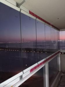 a room with a window with a view of an airport at Departamentos Laguna del mar in La Serena