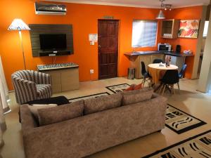 a living room with a couch and a table at JC Studios Ermelo in Ermelo
